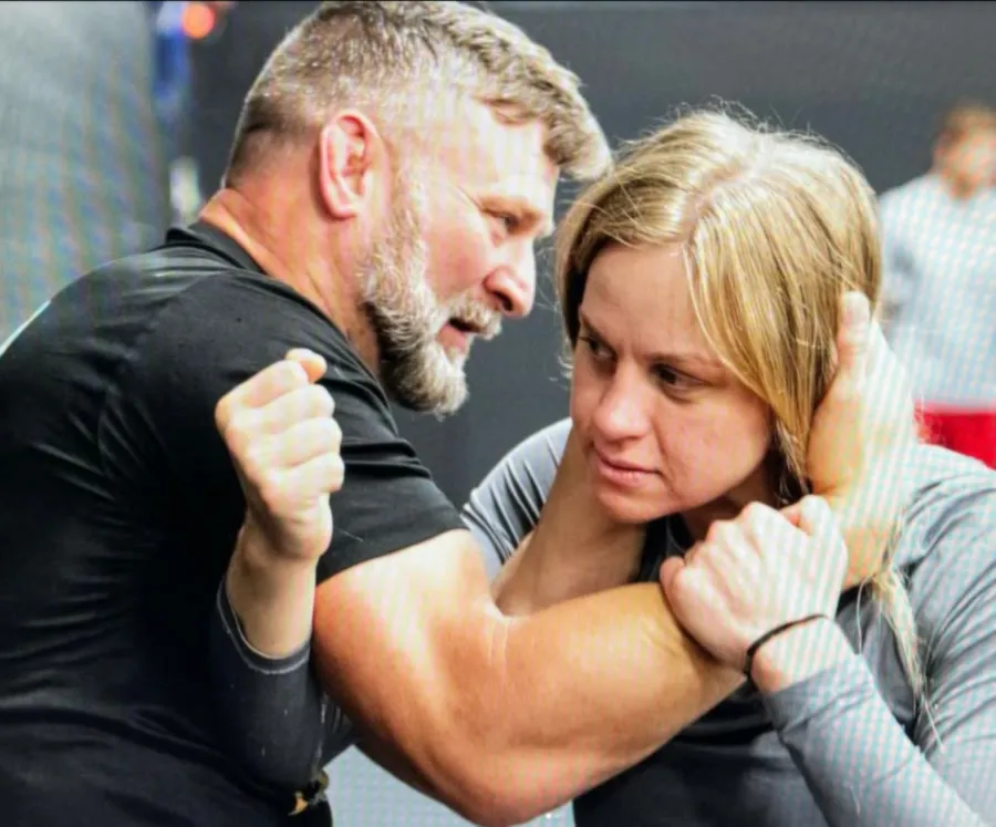Coach Brent Mason drilling a collar-tie clinch with UFC flyweight Carli Judice