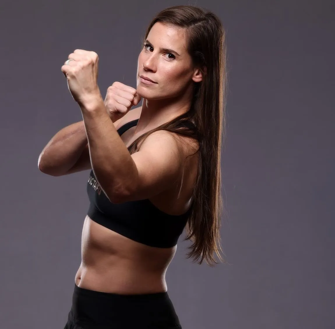 Victoria "Fury" Leonardo Mason in a fighting stance, hands up
